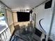 Relaxing screened porch with table and chairs, perfect for outdoor dining at 113 Hummingbird Cir, New London, NC 28127