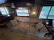 Cozy living room featuring a brown sofa and armchairs at 113 Hummingbird Cir, New London, NC 28127