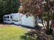Mobile home and storage shed with landscaping at 113 Hummingbird Cir, New London, NC 28127
