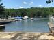 Community boat docks with several boats and a ramp at 113 Hummingbird Cir, New London, NC 28127