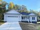 Newly built home with two-car garage and front porch at 2871 Brendale Dr, Lancaster, SC 29720