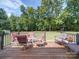 Wooden deck with patio furniture, offering a relaxing backyard view at 115 S Jack Ave, Salisbury, NC 28146