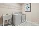 Convenient laundry room with washer, dryer, and utility sink at 211 Coronado Ave # 57, Matthews, NC 28104