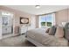 Secondary bedroom with ensuite bathroom and view at 211 Coronado Ave # 57, Matthews, NC 28104