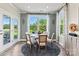 Casual breakfast nook with a table and chairs near a sliding door at 211 Coronado Ave # 57, Matthews, NC 28104