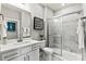 Modern bathroom with white vanity, marble shower, and large mirror at 211 Coronado Ave # 57, Matthews, NC 28104