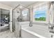 Relaxing bathroom with soaking tub and glass shower at 211 Coronado Ave # 57, Matthews, NC 28104