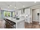 Open kitchen with large island and breakfast bar at 211 Coronado Ave # 57, Matthews, NC 28104