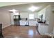 Modern kitchen with stainless steel appliances and light wood flooring at 902 Carmel Dr, Gastonia, NC 28056