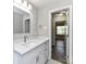 Bright bathroom with white vanity, quartz countertop and access to another room at 3920 Secrest Shortcut Rd, Monroe, NC 28110