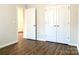 Bedroom with wood flooring and double doors at 14322 Hugh Dixon Way, Huntersville, NC 28078