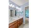 Bathroom with double vanity, mirror, and access to bedroom at 133 Lassen Ln, Mooresville, NC 28117