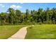 Paved walking trail winds through grassy areas and trees at 133 Lassen Ln, Mooresville, NC 28117