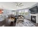 Open living space with a fireplace and views into the kitchen and dining area at 133 Lassen Ln, Mooresville, NC 28117