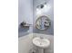 Stylish powder room with a round mirror and modern vanity at 133 Lassen Ln, Mooresville, NC 28117