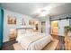 Spacious main bedroom with a large bed and barn door leading to the bathroom at 1713 Dale St, Newton, NC 28658