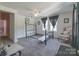 Bedroom with carpeted floor and a floral armchair at 121 W End St, Chester, SC 29706