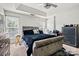 Primary bedroom with tufted sleigh bed and plenty of natural light at 9622 Blossom Hill Dr, Huntersville, NC 28078