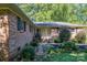 Brick house exterior showcasing the front entrance and landscaping at 1890 Rhyneland Rd, Lincolnton, NC 28092