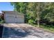 Two-car garage with driveway and backyard view at 1890 Rhyneland Rd, Lincolnton, NC 28092