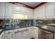 Kitchen features granite countertops and white cabinets at 1890 Rhyneland Rd, Lincolnton, NC 28092