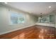 Bright dining room with hardwood floors and large windows at 1890 Rhyneland Rd, Lincolnton, NC 28092