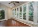 Sunroom with hardwood floors and multiple windows at 1890 Rhyneland Rd, Lincolnton, NC 28092