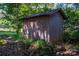 Wooden storage shed nestled in the backyard at 1890 Rhyneland Rd, Lincolnton, NC 28092