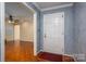 Interior entryway with hardwood floors and a view into the living room at 1890 Rhyneland Rd, Lincolnton, NC 28092