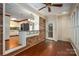 Bright breakfast nook with brick accent wall and access to the backyard at 1890 Rhyneland Rd, Lincolnton, NC 28092