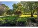 Landscaped front yard with mature trees and lush green grass at 1890 Rhyneland Rd, Lincolnton, NC 28092