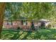 Brick ranch house with a well-maintained lawn at 1890 Rhyneland Rd, Lincolnton, NC 28092