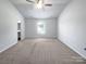 Spacious main bedroom with carpeted floors and ceiling fan at 209 Churchill Dr, Kings Mountain, NC 28086