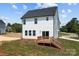 Rear view of house showing deck and landscaping at 103 Dublin Ct, Statesville, NC 28677