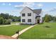 Two-story white house with black windows and walkway at 103 Dublin Ct, Statesville, NC 28677