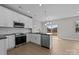 Modern kitchen with stainless steel appliances and island at 103 Dublin Ct, Statesville, NC 28677