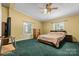 Spacious bedroom with ceiling fan and large windows at 7053 Quailwood Dr, Stanley, NC 28164