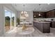 Kitchen with island and dining area, access to deck at 107 Dublin Ct, Statesville, NC 28677