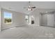 Spacious bedroom with ceiling fan and access to a bathroom at 107 Dublin Ct, Statesville, NC 28677