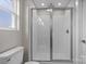 Modern bathroom with a walk-in shower and a window at 107 Dublin Ct, Statesville, NC 28677