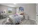 Bright bedroom with window, plush bedding, and a workspace at 107 Dublin Ct, Statesville, NC 28677