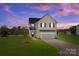 Two-story house with gray siding and lawn at 107 Dublin Ct, Statesville, NC 28677