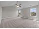 Bright and airy bedroom with a ceiling fan and neutral decor at 107 Dublin Ct, Statesville, NC 28677