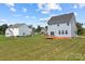 View of two homes with spacious backyard and deck at 107 Dublin Ct, Statesville, NC 28677