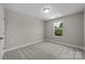 Simple bedroom with carpeted floor and a window at 107 Dublin Ct, Statesville, NC 28677