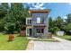 Modern two-story house with gray and white siding, wooden accents, and a landscaped yard at 1498 Robinwood Rd, Gastonia, NC 28054