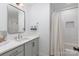 Clean bathroom with gray vanity and shower/tub combo at 1498 Robinwood Rd, Gastonia, NC 28054