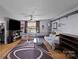 Living room with hardwood floors, large TV and comfy seating at 2110 E Greenbriar Rd, Statesville, NC 28625