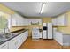 Bright kitchen features ample cabinetry and modern appliances at 2110 E Greenbriar Rd, Statesville, NC 28625