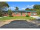 Brick ranch house with a green metal roof and solar panels at 2110 E Greenbriar Rd, Statesville, NC 28625